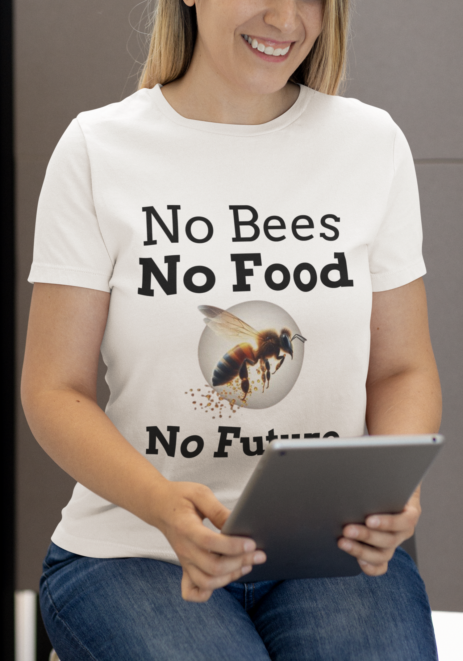 Woman smiling while reading a report and wearing a white T Shirt with the logo No Bees No Food No Future 