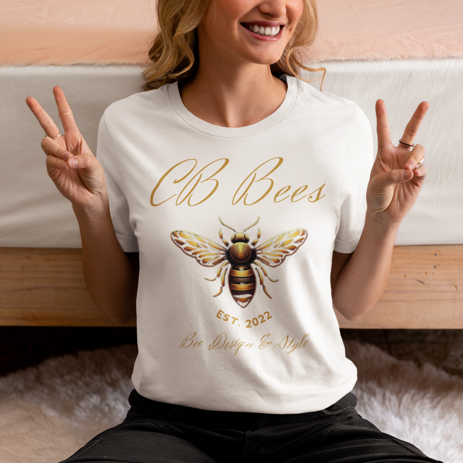 Cbbees the worlds best bee themed T Shirt showing a smiling female model giving the  v for victory sign from the worlds best bee themed product store CBBees.shop